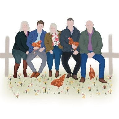 Five people sitting together with chickens in a grassy area, smiling at the camera.