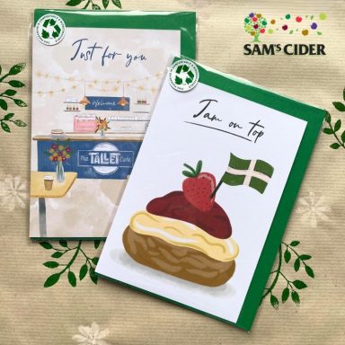 Two cards with illustrations: one with flowers, the other featuring a cake with strawberry.